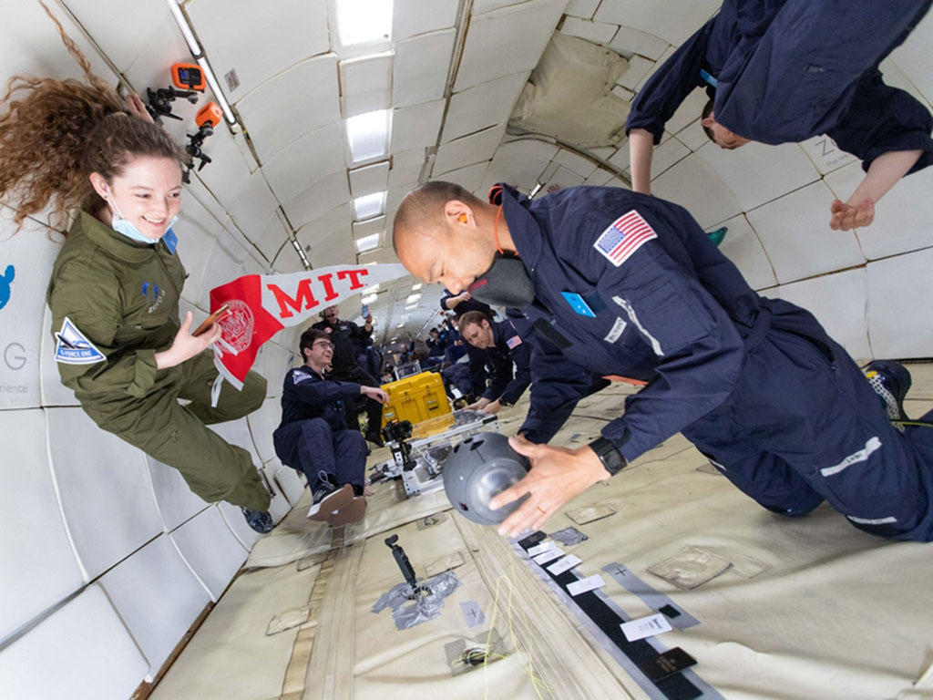 Che-Wei Wang operates the Zenolith, a free-flying pointing device to orient space travelers in the universe, while Ariel Ekblaw looks on. Ekblaw is director of the Space Exploration Initiative at MIT and instructor of a class on preparing research project